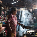 cook in local market cambodia