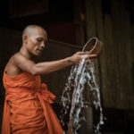 monk water blessing cambodia