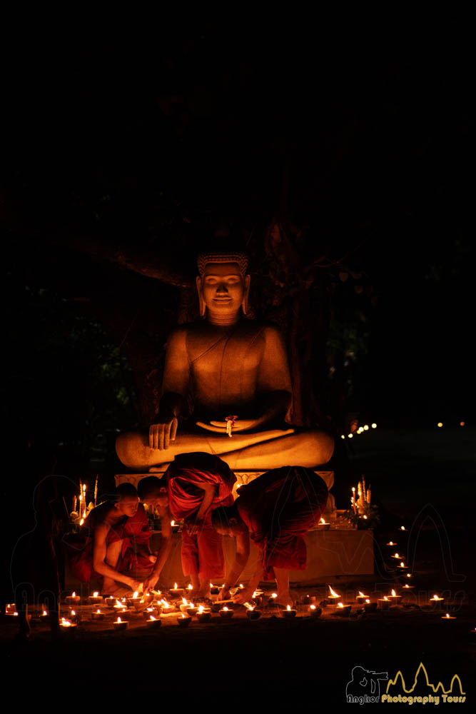 monks in front of Buddha at Meak Bochea